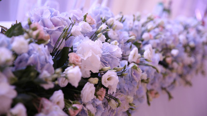 stylish table with fruits and flowers for a holiday on the outdo.