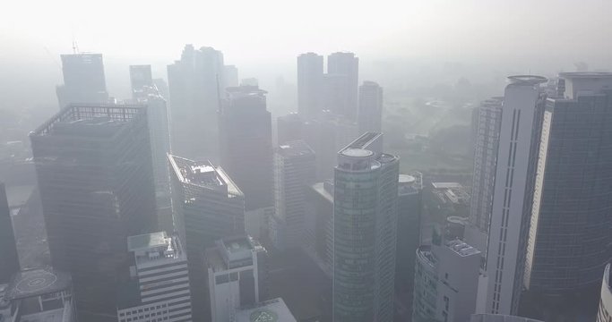 Ungraded, Straight aerial flight from helipad towards skyscrapers in busy metropolitan city. Drone, 4K.