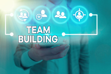 Text sign showing Team Building. Business photo showcasing various types of activities used to enhance social relations