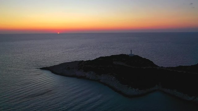 Sunset Cape Doukato. Lefkada island, Greece, Lighthouse view over sunset