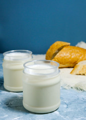 Obraz na płótnie Canvas Two oat milk with a piece of bread