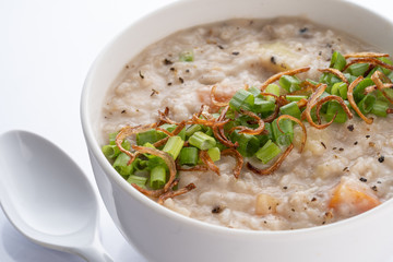 ramadhan famous food bubur lambuk in a white bowl and background