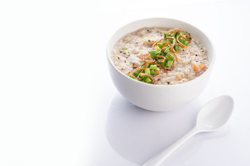 ramadhan famous food bubur lambuk in a white bowl and background