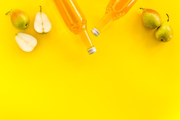 Bottles of beer with peer top view copy space