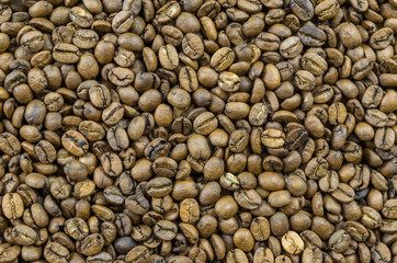 Texture, background of whole coffee beans, raw.