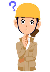 疑問を持つベージュ色の作業着を着てヘルメットを被った女性
