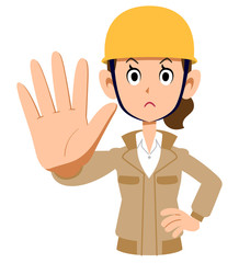 制止するベージュ色の作業着を着てヘルメットを被った女性
