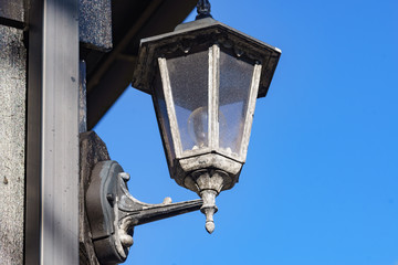 Old lamp on wall, street lantern outdoor