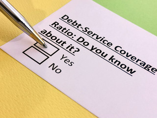 Fototapeta premium A person is answering question about debt service coverage ratio.