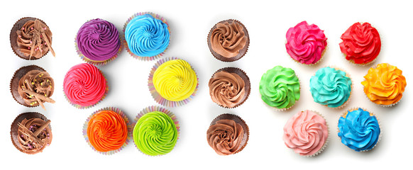 Many colorful cupcakes on white background, top view