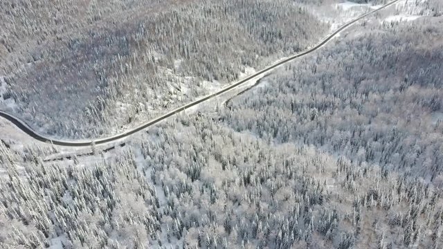 Aerial view of snowy trees and road. Sheregesh, Siberia