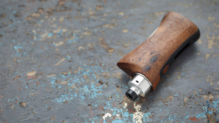 high end rebuildable dripping atomizer with stabilized natural walnut wood regulated box mods, vaping device, selective focus