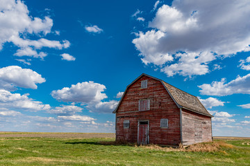 Vintage red barn on the prairies near White Bear, Saskatchewan  - obrazy, fototapety, plakaty