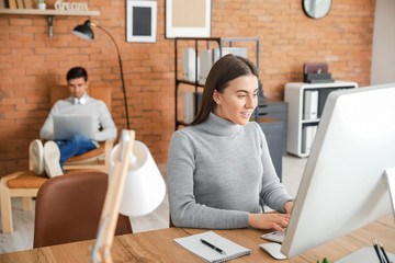 Young woman with husband working together at home