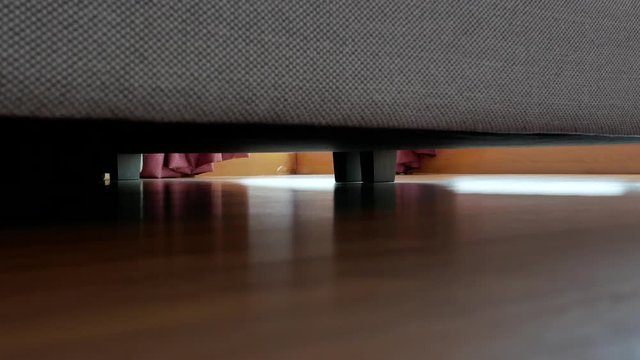 Robotic vacuum cleaner cleaning the floor in the bedroom.