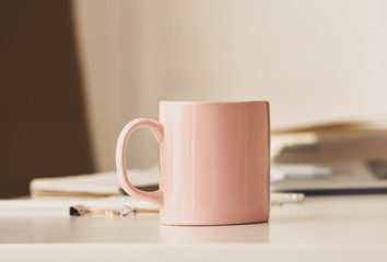 Cup of tea on table in office