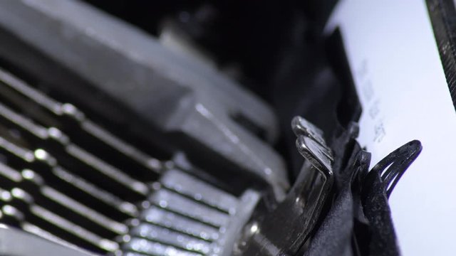 Typo keys of a old qwerty manual typewriter writing a letter