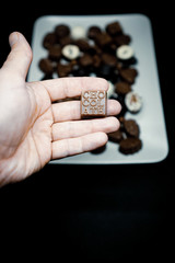 Fototapeta premium man holding a square chocolate.