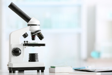 Modern microscope on table in laboratory