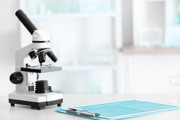 Modern microscope on table in laboratory
