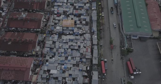 Ungraded, Bird's eye perspective aerial flight hovering over poor neighbourhood in Tondo. Drone, 4K. 