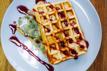 tasty Belgium waffle with organic sweets served for breakfast