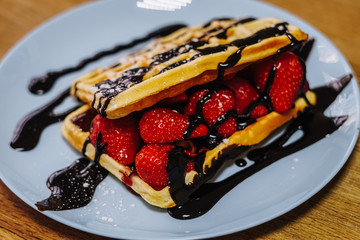 tasty Belgium waffle with organic sweets served for breakfast
