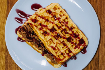 tasty Belgium waffle with organic sweets served for breakfast