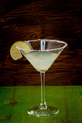 margarita cocktail in martini glass on a dark background