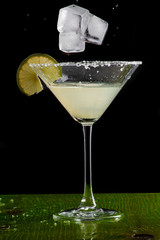margarita cocktail in martini glass on a dark background