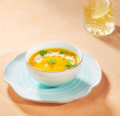 Mexican salad dish on light orange background, served with mayonnaise sauce. 