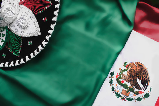 Mexico flag, Mexican sombrero, top view, top-down photo. México Independence Day congratulations. Free space for text. Background template for headers, newsletters, congratulations for subscribers.