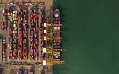 Logistics and transportation of Container Cargo ship with working crane bridge, logistic import export and transport industry background