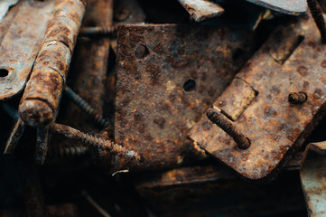Scrap metal. Rusty screws, latches, curtain. Rust texture. Close-up. Macro. Corrosion of metal