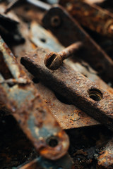 Scrap metal. Rusty screws, latches, curtain. Rust texture. Close-up. Macro. Corrosion of metal