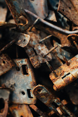 Scrap metal. Rusty screws, latches, curtain. Rust texture. Close-up. Macro. Corrosion of metal