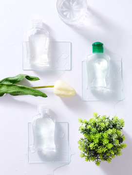 Real photo, product mockups template, some elements : apple, flower, tea leaf, light white background.