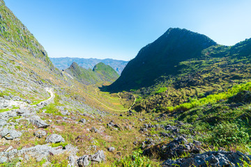 Ha Giang karst geopark mountain landscape in North Vietnam. Winding road in stunning scenery. Ha Giang motorbike loop, famous travel destination bikers easy riders.