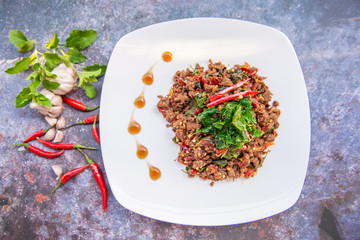 Thai Food Rice topped with egg and stir-fried beef and basil, famous street food in Thailand, fast food, soft focus