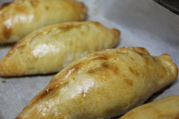 baked pies with filling prepared in the oven