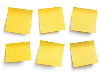 Yellow blank sticky paper sheets, isolated on white background