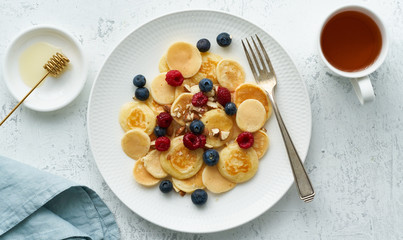 Tiny pancakes, small thin funny crumpet, children's food.