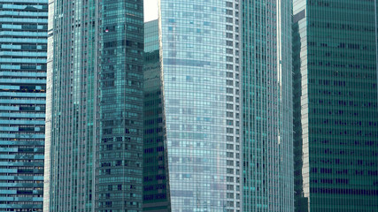 Telephoto View of Glass Facade of Multiple Modern Office Skyscrapers in Singapore