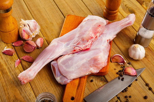 Preparation of raw goatling shoulder meat on cutting board