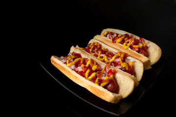 hot dogs on black table