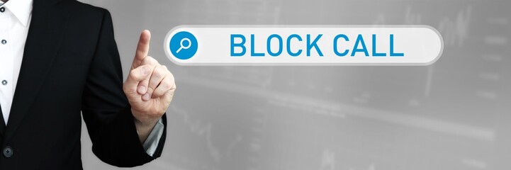 Block Call. Businessman (Man) in a suit pointing with his finger to a search box. The word is in focus. Blue Background. Business, Finance, Statistics, Analysis, Economy