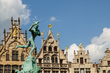 Fototapeta na wymiar Antwerp, Flanders, Belgium. August 2019. The town hall square, overlook the most beautiful buildings in the city. Detail of the Brabone fountain, dedicated to the founder of the city.