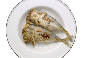 Fried mackerel on a plate, isolated on white background with clipping path