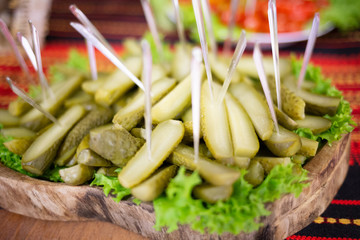 Cucumbers with greens on a plate
