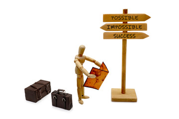 MANIKIN WITH LUGGAGE AND ROAD SIGN WITH POSSIBLE IMPOSSIBLE SUCCESS INSCRIPTION - MANICHINO CON...